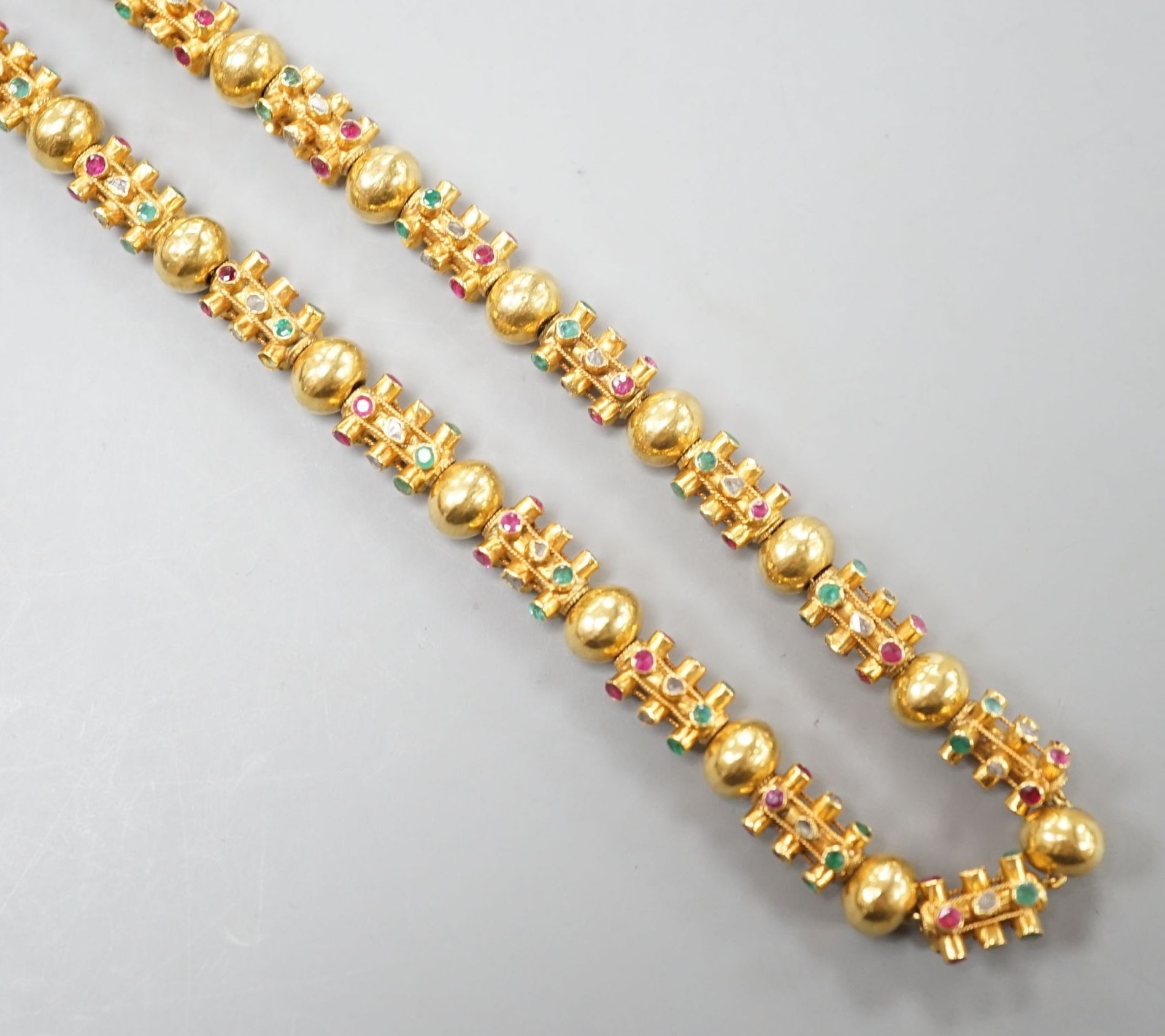 A modern Thai yellow metal and multi gem set necklace, 70cm, gross weight 55.1 grams.